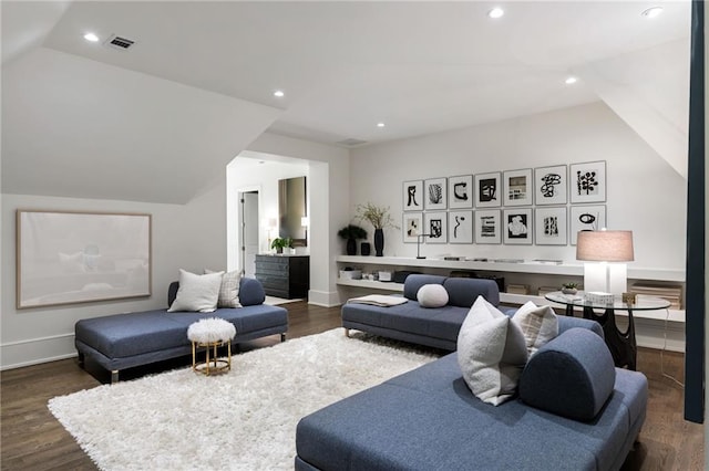 living room featuring visible vents, recessed lighting, wood finished floors, and vaulted ceiling