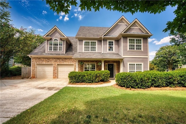 craftsman-style house with a garage and a front yard