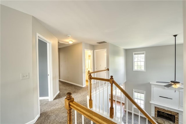 hallway with carpet floors