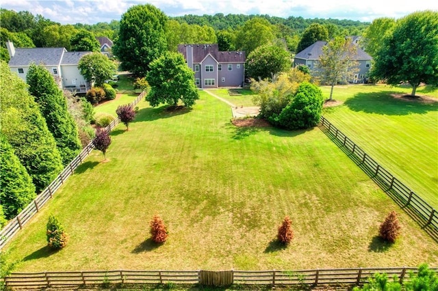 birds eye view of property with a rural view