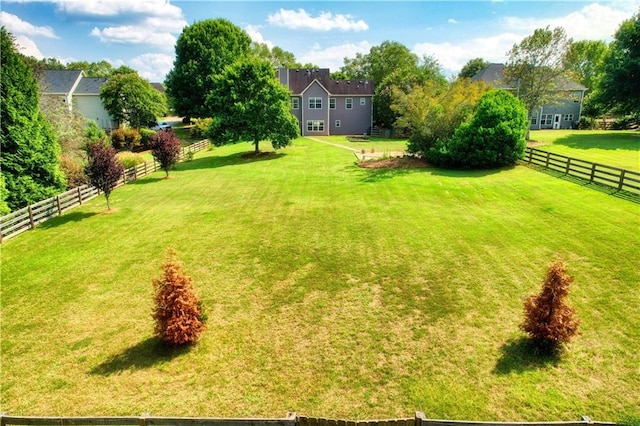 view of yard with a rural view