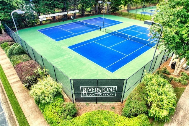 view of sport court featuring basketball hoop