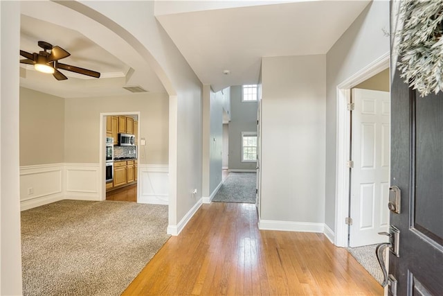 entrance foyer featuring ceiling fan and light hardwood / wood-style floors