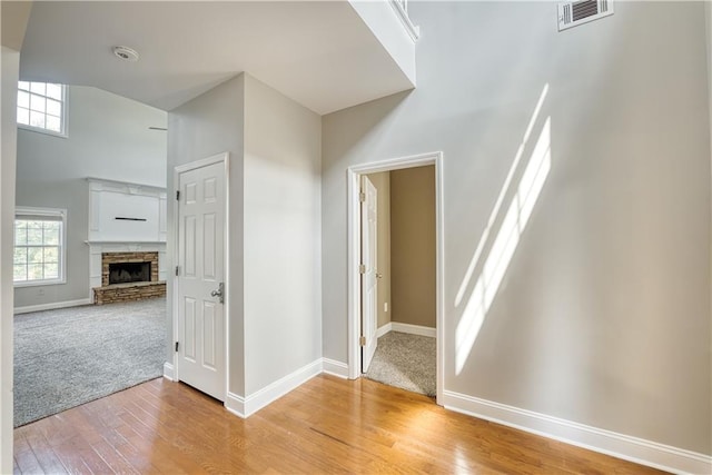 hallway with light carpet and a wealth of natural light