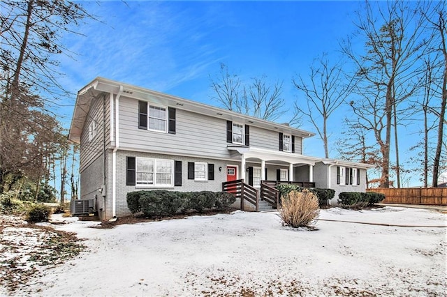 view of front of property featuring covered porch and central air condition unit