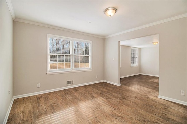 unfurnished room featuring dark hardwood / wood-style flooring, plenty of natural light, and crown molding