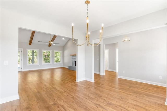 101 Red Oak Ln, Carrollton, GA 30116 - unfurnished living room featuring a ceiling fan, a brick fireplace, light wood-style floors, and baseboards