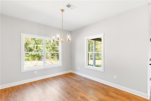 101 Red Oak Ln, Carrollton, GA 30116 - empty room with a chandelier, plenty of natural light, and baseboards