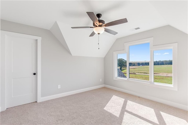 101 Red Oak Ln, Carrollton, GA 30116 - bonus room featuring lofted ceiling, ceiling fan, light colored carpet, and baseboards