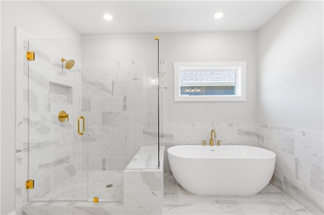 101 Red Oak Ln, Carrollton, GA 30116 - bathroom with a shower stall, a freestanding bath, recessed lighting, marble finish flooring, and tile walls