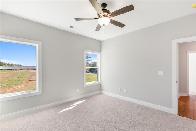 101 Red Oak Ln, Carrollton, GA 30116 - unfurnished room with baseboards, ceiling fan, and carpet flooring