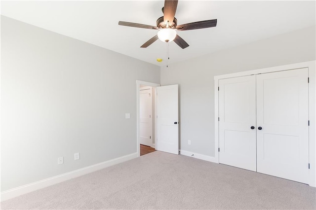 101 Red Oak Ln, Carrollton, GA 30116 - unfurnished bedroom with carpet floors, baseboards, a closet, and a ceiling fan