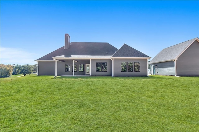 101 Red Oak Ln, Carrollton, GA 30116 - back of property with a patio, a chimney, a yard, and ceiling fan