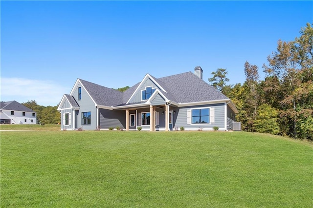 101 Red Oak Ln, Carrollton, GA 30116 - view of front of home with a front lawn, a chimney, and covered porch