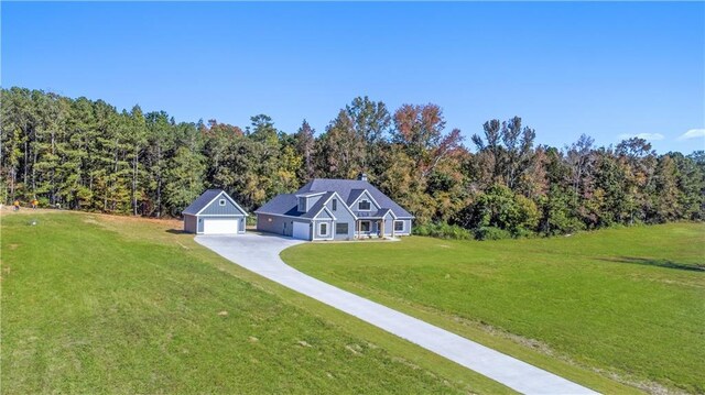 101 Red Oak Ln, Carrollton, GA 30116 - view of front facade featuring a front yard, driveway, and a view of trees