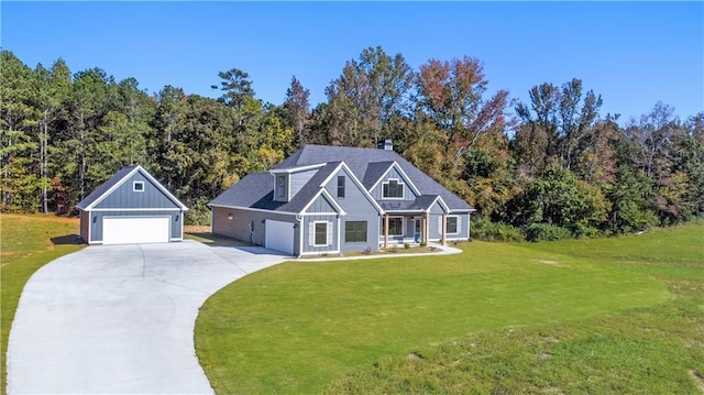101 Red Oak Ln, Carrollton, GA 30116 - view of front facade featuring driveway, a front lawn, a chimney, and board and batten siding