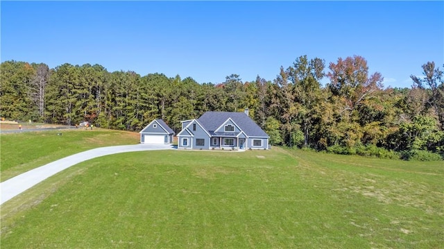 101 Red Oak Ln, Carrollton, GA 30116 - view of front facade featuring a front yard, a view of trees, driveway, and a garage