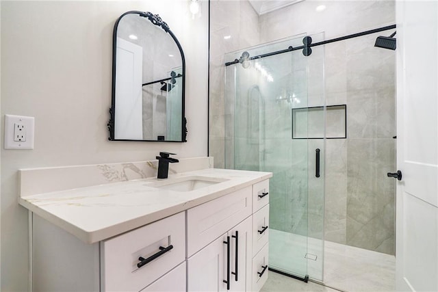 bathroom featuring vanity and an enclosed shower