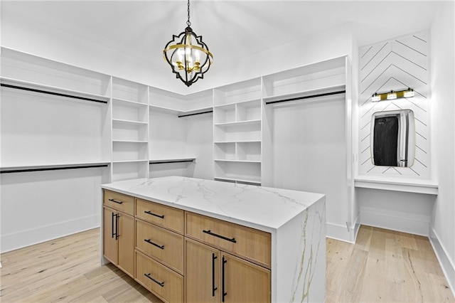 walk in closet featuring light wood-type flooring