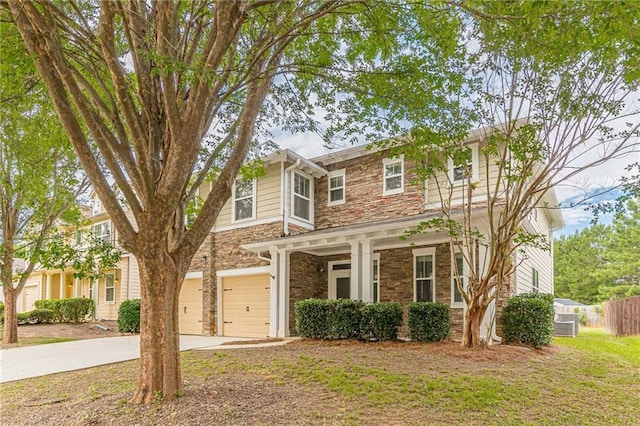 view of front of property with a garage and a front lawn