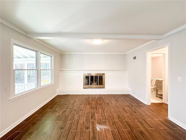 unfurnished living room featuring crown molding, beam ceiling, and a brick fireplace