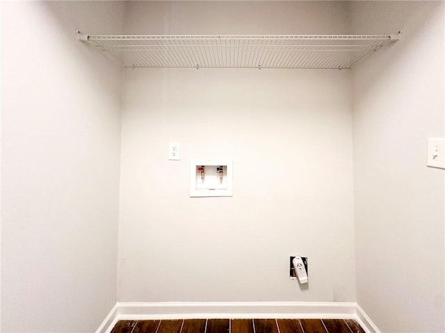 clothes washing area featuring washer hookup and dark hardwood / wood-style floors