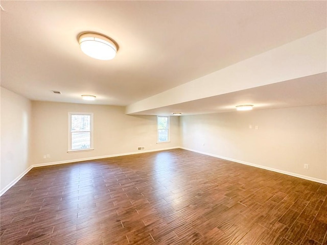 basement featuring dark wood-type flooring