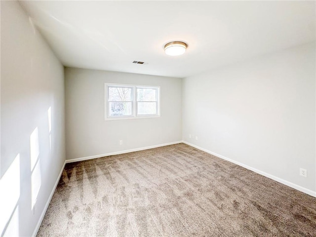 empty room with carpet flooring