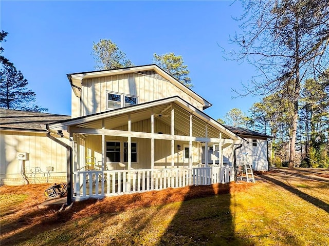 view of front of house with a front lawn and a porch