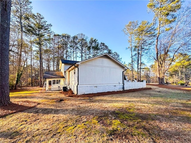 view of property exterior with a lawn