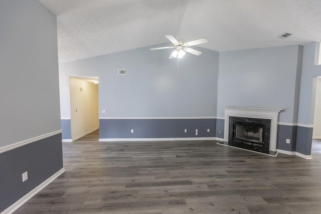 706 Hillmont Dr, Loganville, GA 30052 - unfurnished living room with vaulted ceiling, a ceiling fan, wood finished floors, and a premium fireplace