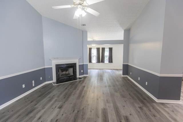 706 Hillmont Dr, Loganville, GA 30052 - unfurnished living room featuring a ceiling fan, wood finished floors, and a premium fireplace