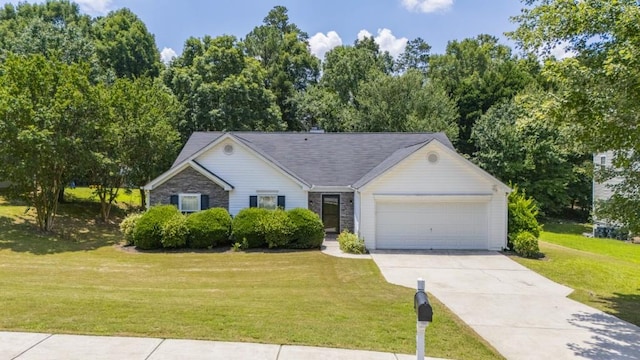 706 Hillmont Dr, Loganville, GA 30052 - view of front of house featuring an attached garage, a front yard, and driveway