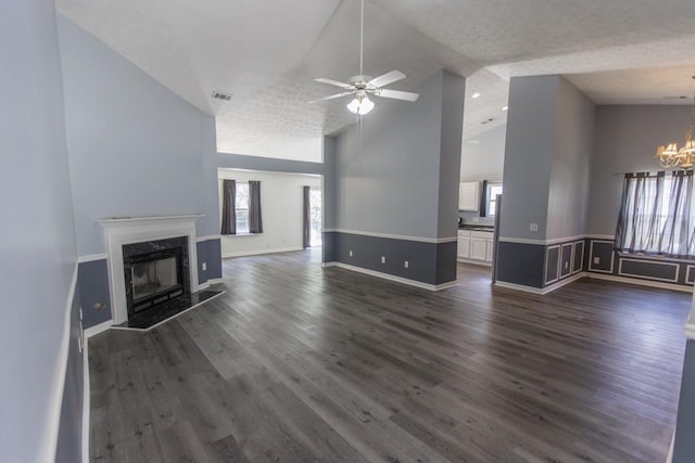 706 Hillmont Dr, Loganville, GA 30052 - unfurnished living room featuring a chandelier, plenty of natural light, a ceiling fan, a premium fireplace, and high vaulted ceiling