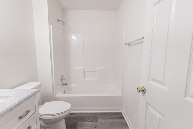 706 Hillmont Dr, Loganville, GA 30052 - bathroom featuring vanity, wood finished floors, and bathtub / shower combination