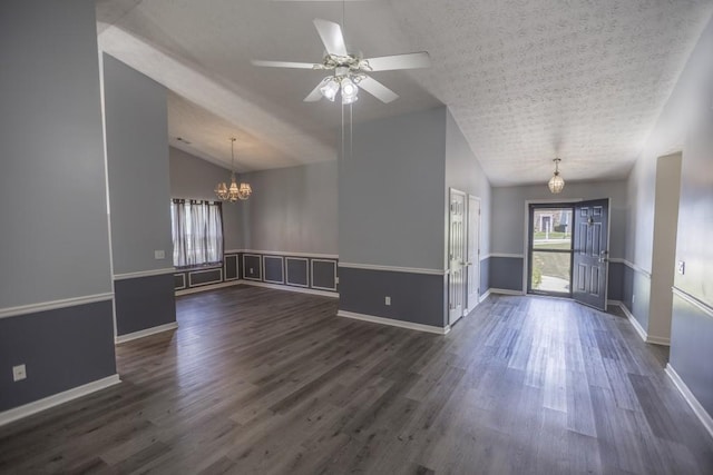 706 Hillmont Dr, Loganville, GA 30052 - spare room with a chandelier, dark wood-type flooring, ceiling fan, a textured ceiling, and high vaulted ceiling