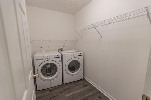706 Hillmont Dr, Loganville, GA 30052 - washroom with washer and clothes dryer and dark wood-type flooring