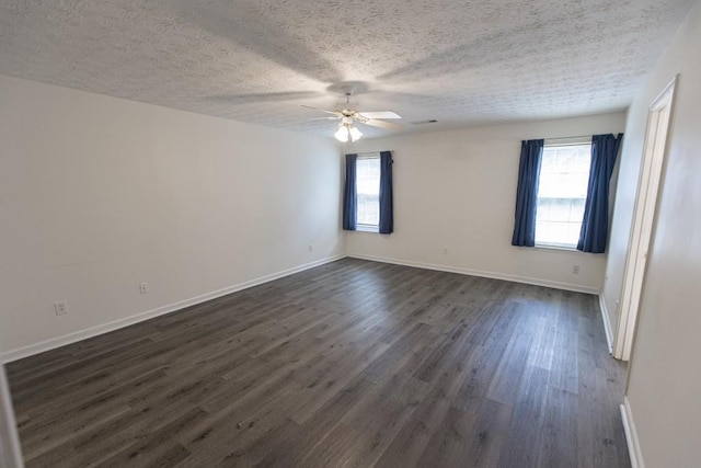 706 Hillmont Dr, Loganville, GA 30052 - unfurnished room with a ceiling fan, dark wood-type flooring, and a textured ceiling