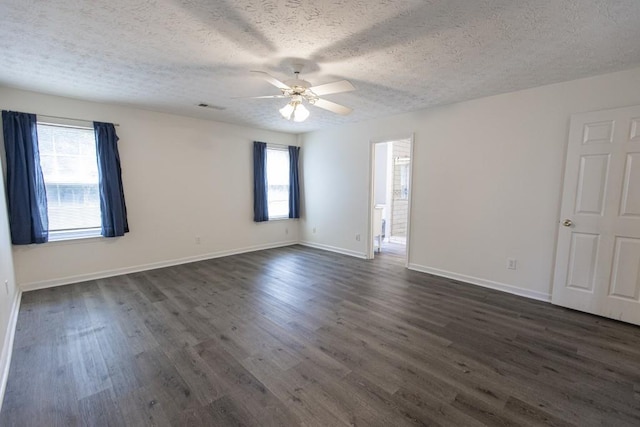 706 Hillmont Dr, Loganville, GA 30052 - unfurnished room featuring a textured ceiling, a ceiling fan, and dark wood finished floors