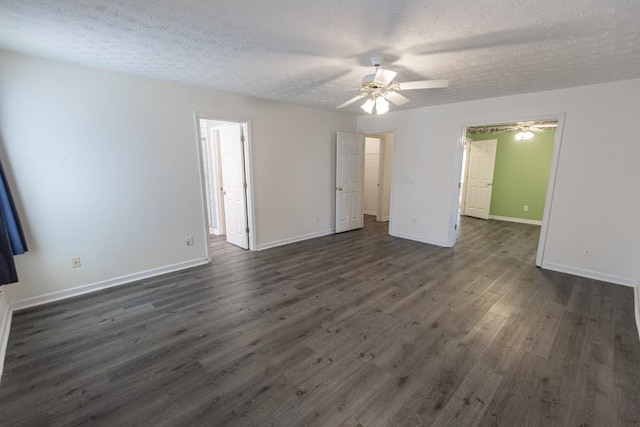 706 Hillmont Dr, Loganville, GA 30052 - unfurnished bedroom with dark wood finished floors, a textured ceiling, and ceiling fan