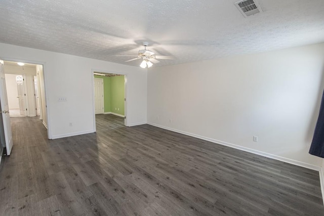 706 Hillmont Dr, Loganville, GA 30052 - spare room with a ceiling fan, dark wood-style flooring, and a textured ceiling