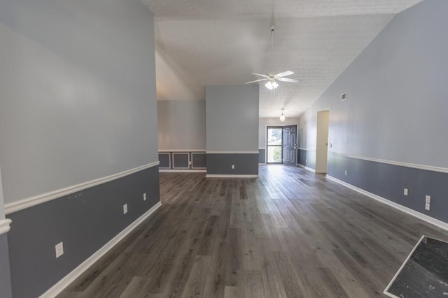 706 Hillmont Dr, Loganville, GA 30052 - unfurnished living room with a ceiling fan, wood finished floors, and lofted ceiling