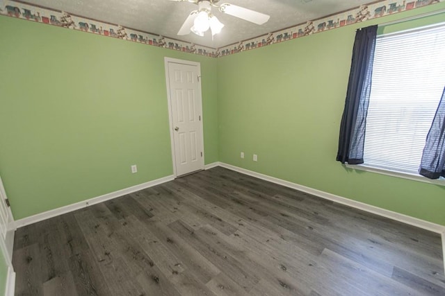 706 Hillmont Dr, Loganville, GA 30052 - unfurnished room featuring a textured ceiling, dark wood finished floors, and a ceiling fan