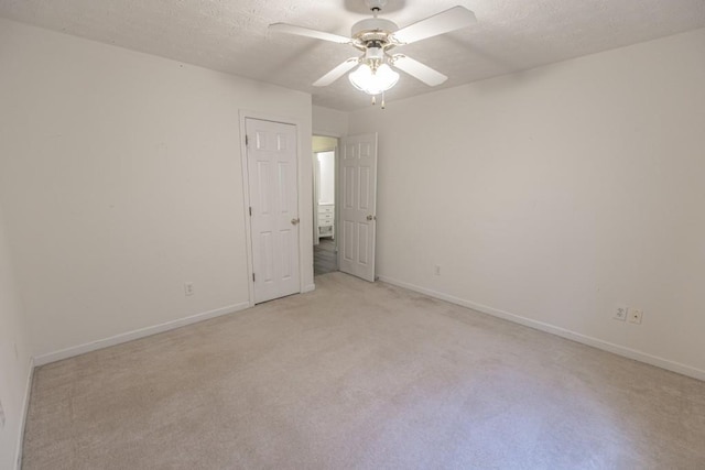 706 Hillmont Dr, Loganville, GA 30052 - unfurnished room with light carpet, a ceiling fan, and a textured ceiling