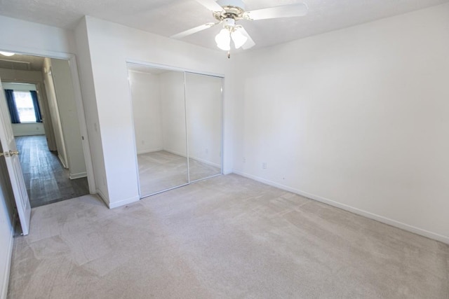 706 Hillmont Dr, Loganville, GA 30052 - unfurnished bedroom featuring light carpet, a closet, attic access, and a ceiling fan