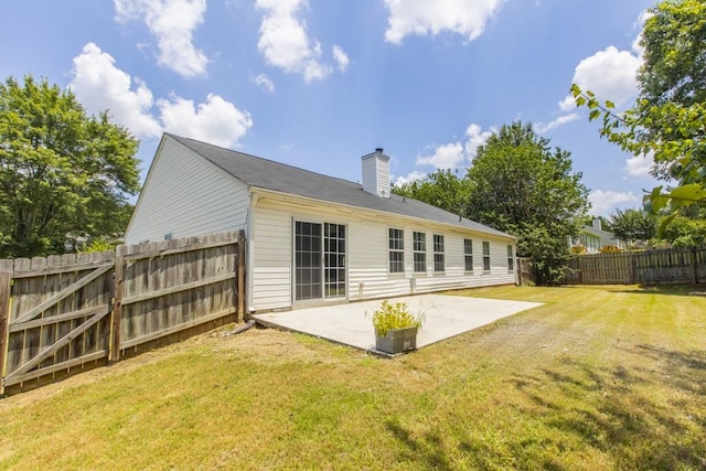 706 Hillmont Dr, Loganville, GA 30052 - back of property with a patio, a chimney, and a fenced backyard