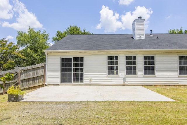 706 Hillmont Dr, Loganville, GA 30052 - back of property with a patio and a chimney