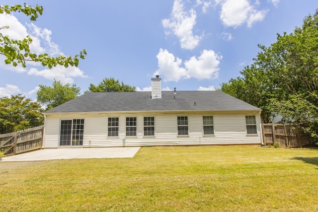 706 Hillmont Dr, Loganville, GA 30052 - rear view of property featuring a patio area and a chimney