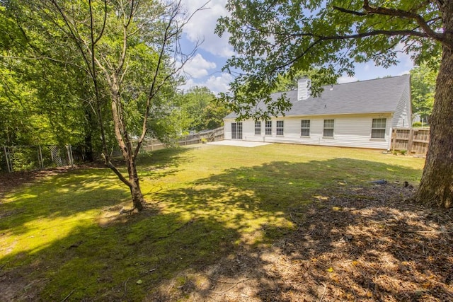 706 Hillmont Dr, Loganville, GA 30052 - fenced backyard with a patio