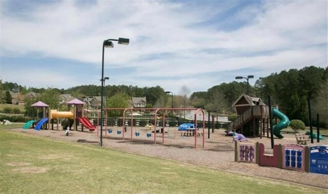 view of playground with a yard